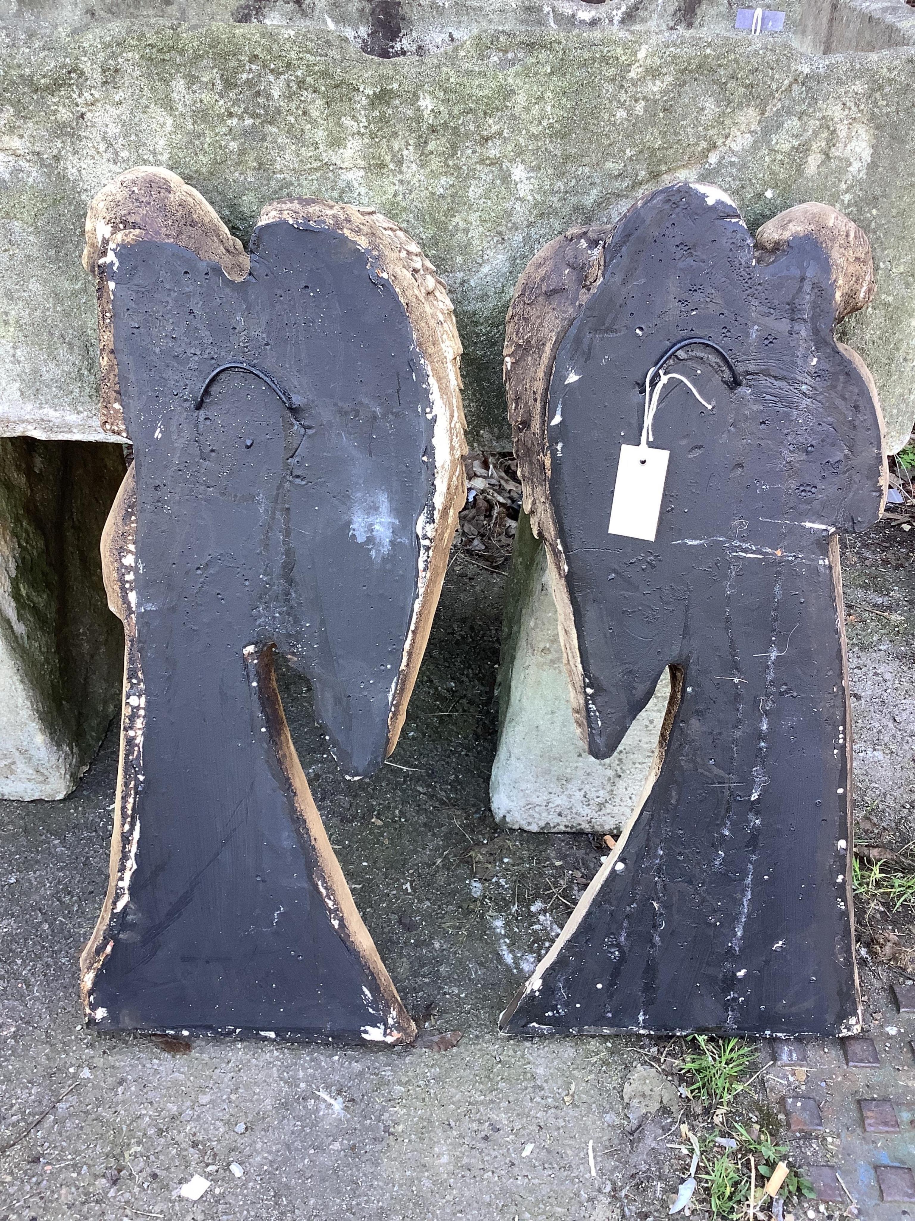 A pair of cast angel wall appliqués, height 78cm. Condition - fair to good